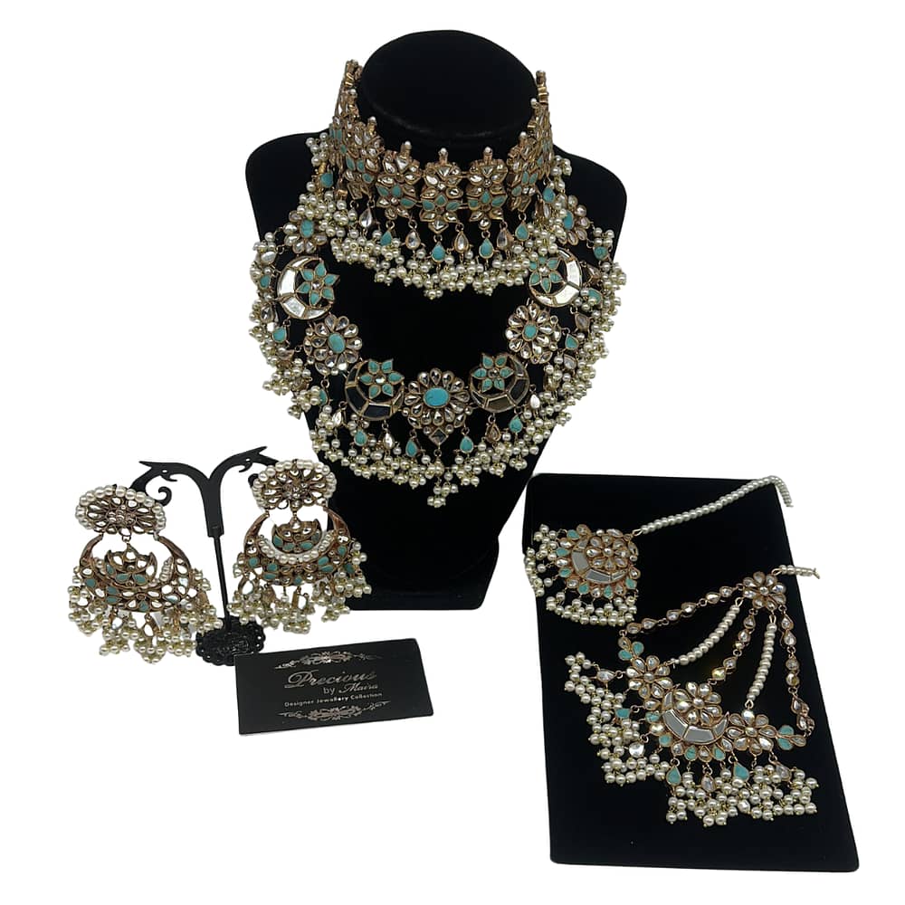 Double necklace kundan set with matching Chand Bali, tikka and jhomer in feroza with pearls finish