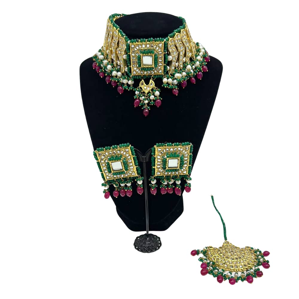 Kundan choker set with semi precious emeralds border and real pearls with ruby hanging