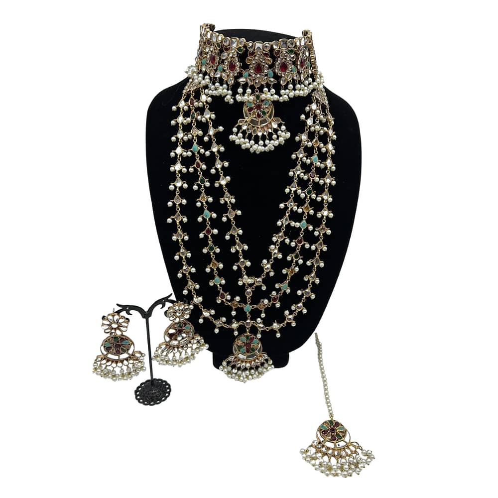 Multi kudan choker with three layered Mala, matching earrings and tikka in pearls finish