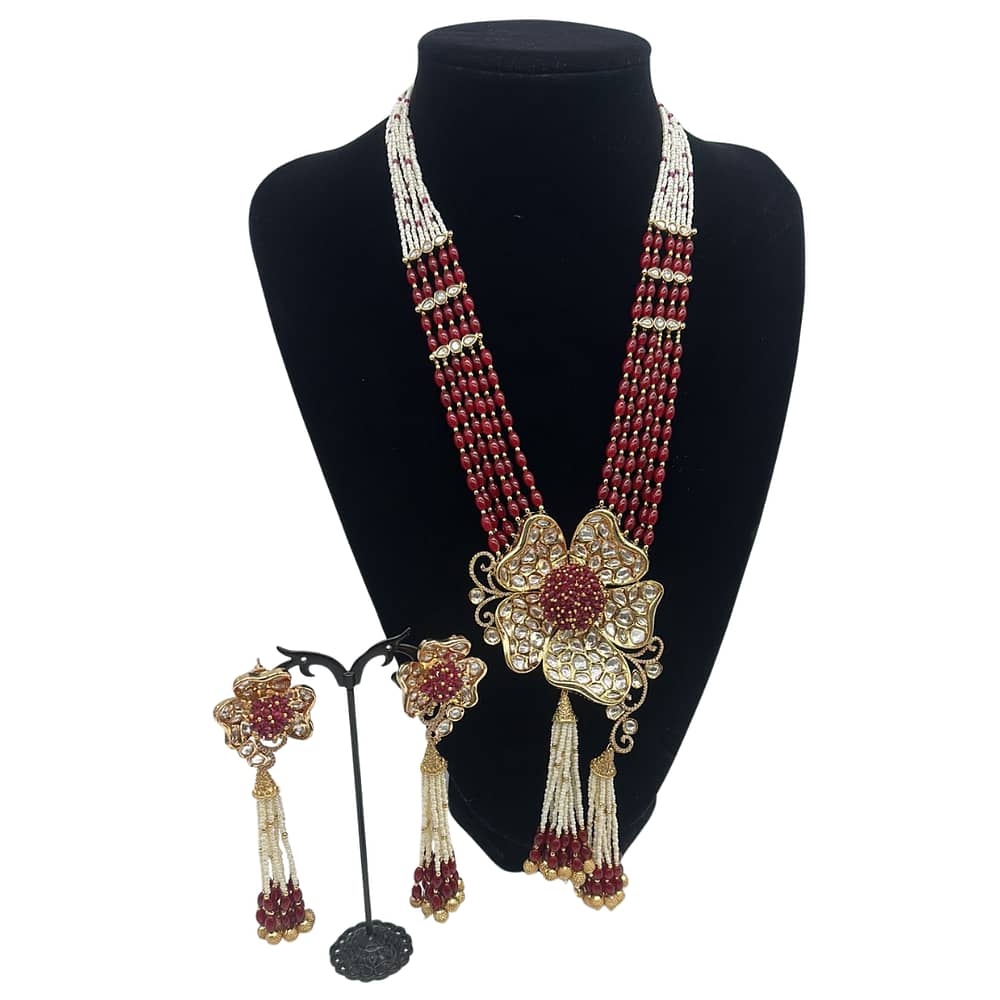 3D flower shaped pendant with tassel style earrings in ruby and pearls