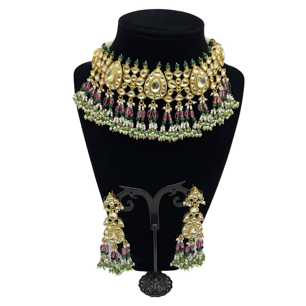 Pachi kundan set with ruby, emeralds and pearls hanging.