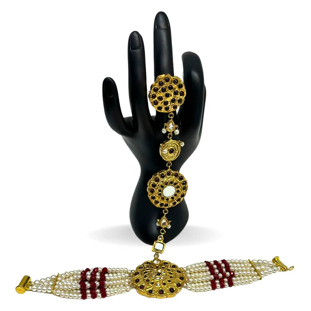 Kundan pearls bracelet attached with adjustable ring in ruby finish