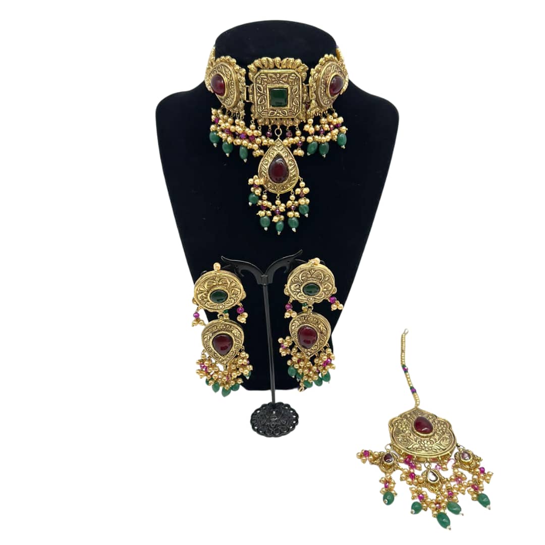 Multani style kundan choker with gold pearls, ruby and emeralds finish