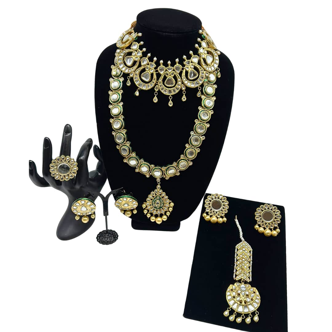 Kundan necklace meenakari border with long Mala and statement tikka. The set comes with two pairs of earrings and adjustable ring