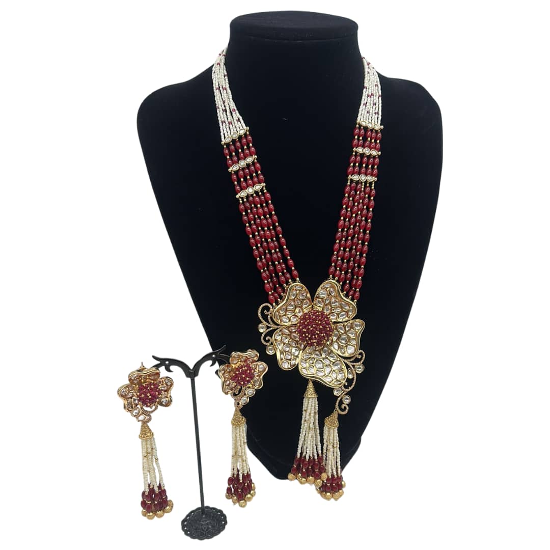 3D flower shaped pendant with tassel style earrings in ruby and pearls