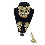 Beautifully crafted kundan set with red crystal strands in ruby, emeralds and pearls