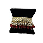 Pair of kundan bangles with lock and pearls and ruby hanging