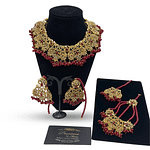 Intricately designed set with pearls and ruby finish