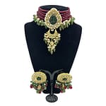 Kundan choker with hand carved emeralds, semi precious ruby strands and real pearls hanging