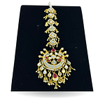 Sheesha kundan statement tikka with hint of ruby and pearls