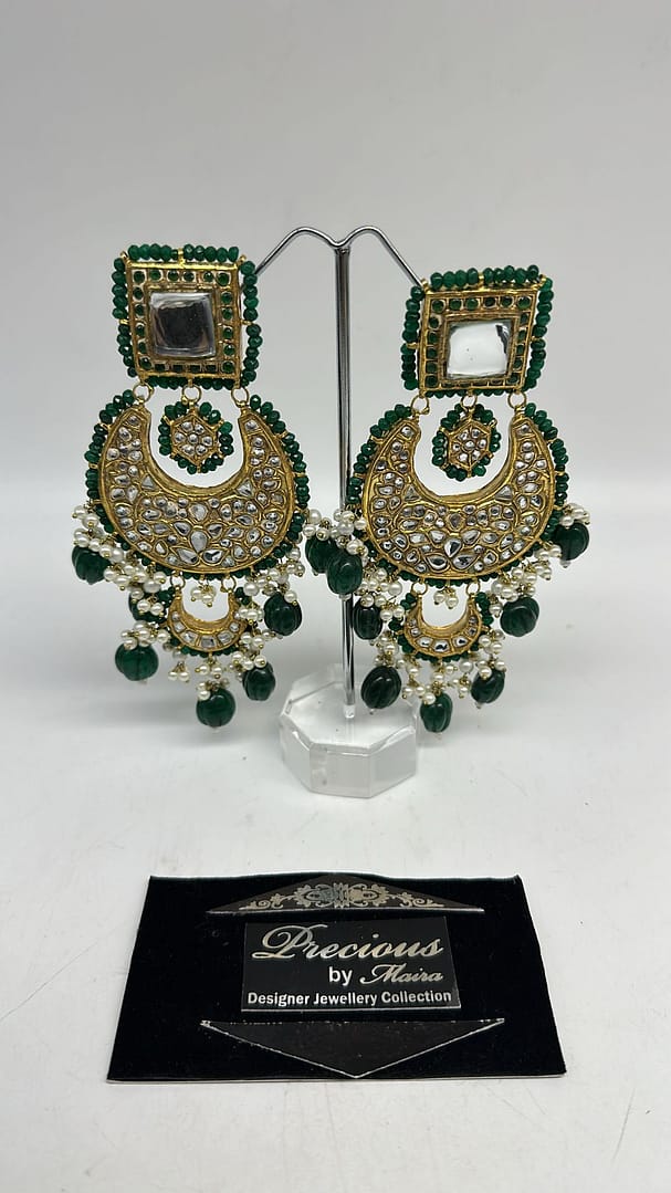 Statement kundan earrings with pearl and semi precious emeralds finish