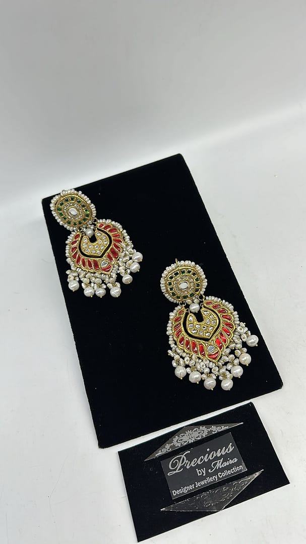 Beautifully handcrafted kundan earrings two tone colored kundan and real pearls finish